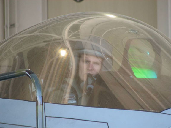 The pilot of F-22 03-041 on April 10, 2006 awaiting rescue from the cockpit.