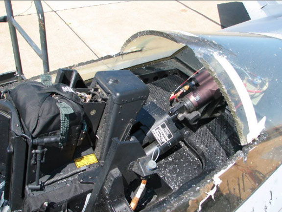 Debris littered the cockpit of F-22 Raptor 03-041 after maintenance personnel were forced to cut the canopy to free the trapped pilot.